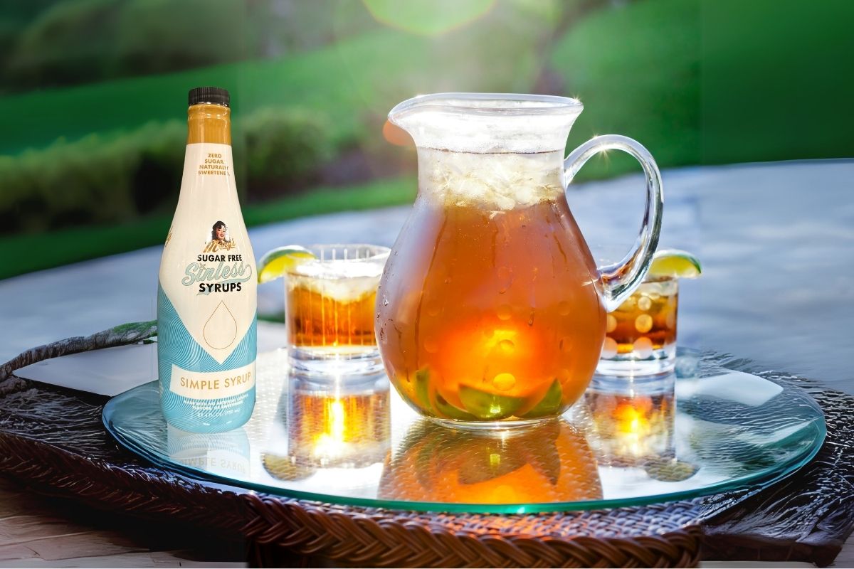 Pitcher of Skinny Sweet Tea with bottle of Sugar Free Sinless Simple Syrup