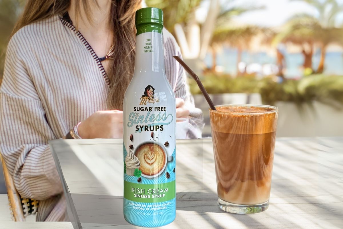 woman sitting outdoors enjoying Irish Iced Coffee