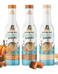 Three bottles of sugar-free coffee syrups with pumpkins, caramel, and marshmallows on a white background.