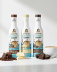 Three bottles of Sugar Free Syrups with a cup of coffee and chocolate on a white background