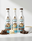 Three bottles of Sugar Free Syrups with a cup of coffee and chocolate on a white background