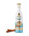 Bottle of sugar-free cinnamon dolce syrup with a white background