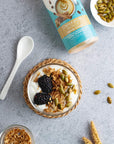 Bottle of sugar-free Cinnamon Dolce syrup with yogurt on grey counter