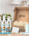 Three bottles of sugar-free syrups in front of a 'Miss Mary's' branded box.
