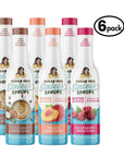 Six bottles of Sugar Free Sinless Syrups on a white background