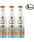 Three bottles of Sugar Free Sinless Syrups salted caramel flavor on a white background.