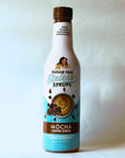 Miss Mary's Mocha Sugar Free Sinless Syrup bottle on blue background