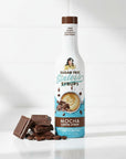 Mocha Sinless Syrup bottle with coffee beans and chocolate on white background