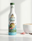 Peppermint Pattie Sinless Syrup bottle and coffee cup on white background