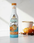Pumpkin Spice Sinless Syrup bottle with fall spices on white background
