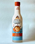Miss Mary's Salted Caramel Sugar Free Sinless Syrup bottle on blue background