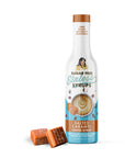 Sugar Free Sinless Syrups salted caramel coffee syrup bottle with two caramels on a white background