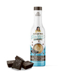 Bottle of Sugar Free Sinless Syrups Salted Dark Chocolate Coffee Syrup with chocolate pieces on a white background