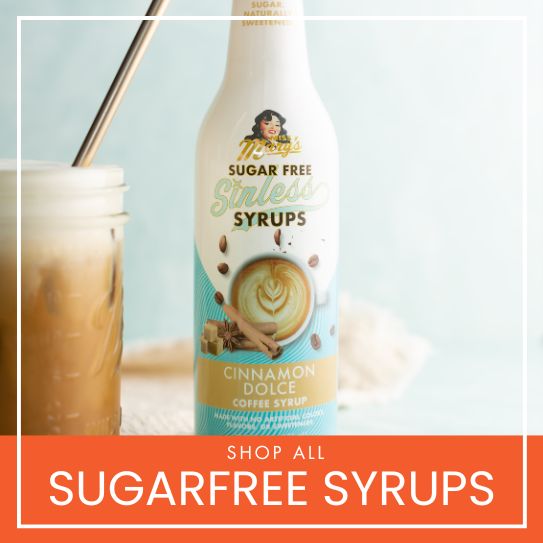 Sugar-free syrup bottle with a glass of iced coffee on a light blue background