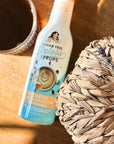 Bottle of toasted marshmallow coffee syrup from Miss Mary's Mix next to wicker pumpkin and glass coffee cup