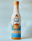 Miss Mary's Toasted Marshmallow Sugar Free Sinless Syrup bottle on blue background
