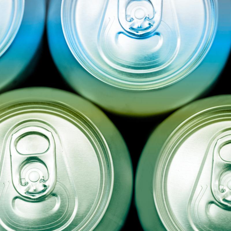 Blue & Green soda cans on black background