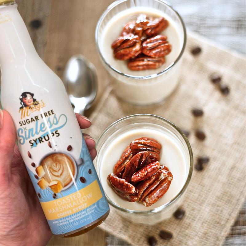 Toasted Marshmallow Sinless Syrup with yogurt and pecans on neutral background