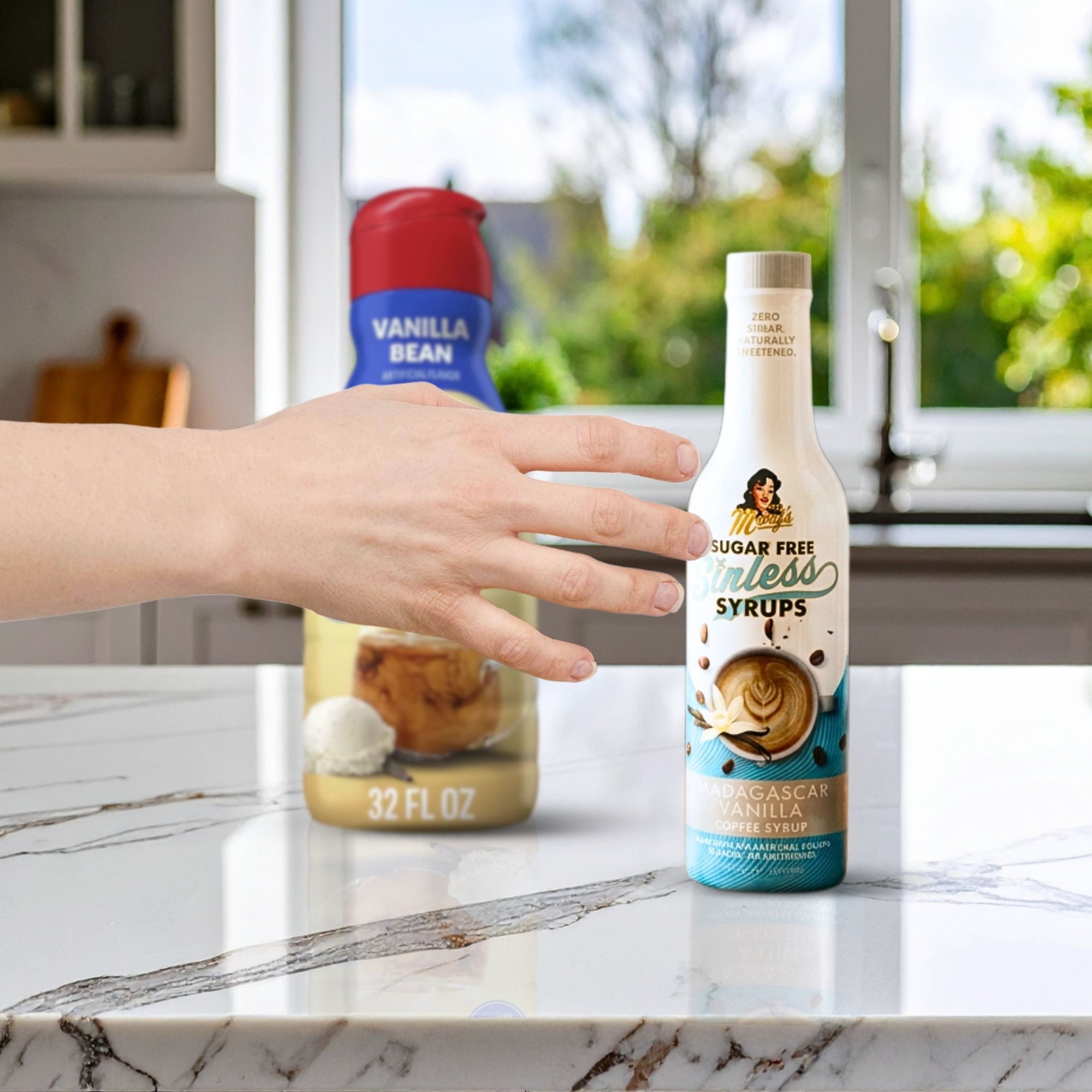 hand reaching for Sugar Free Sinless Syrup bottle with kitchen in background