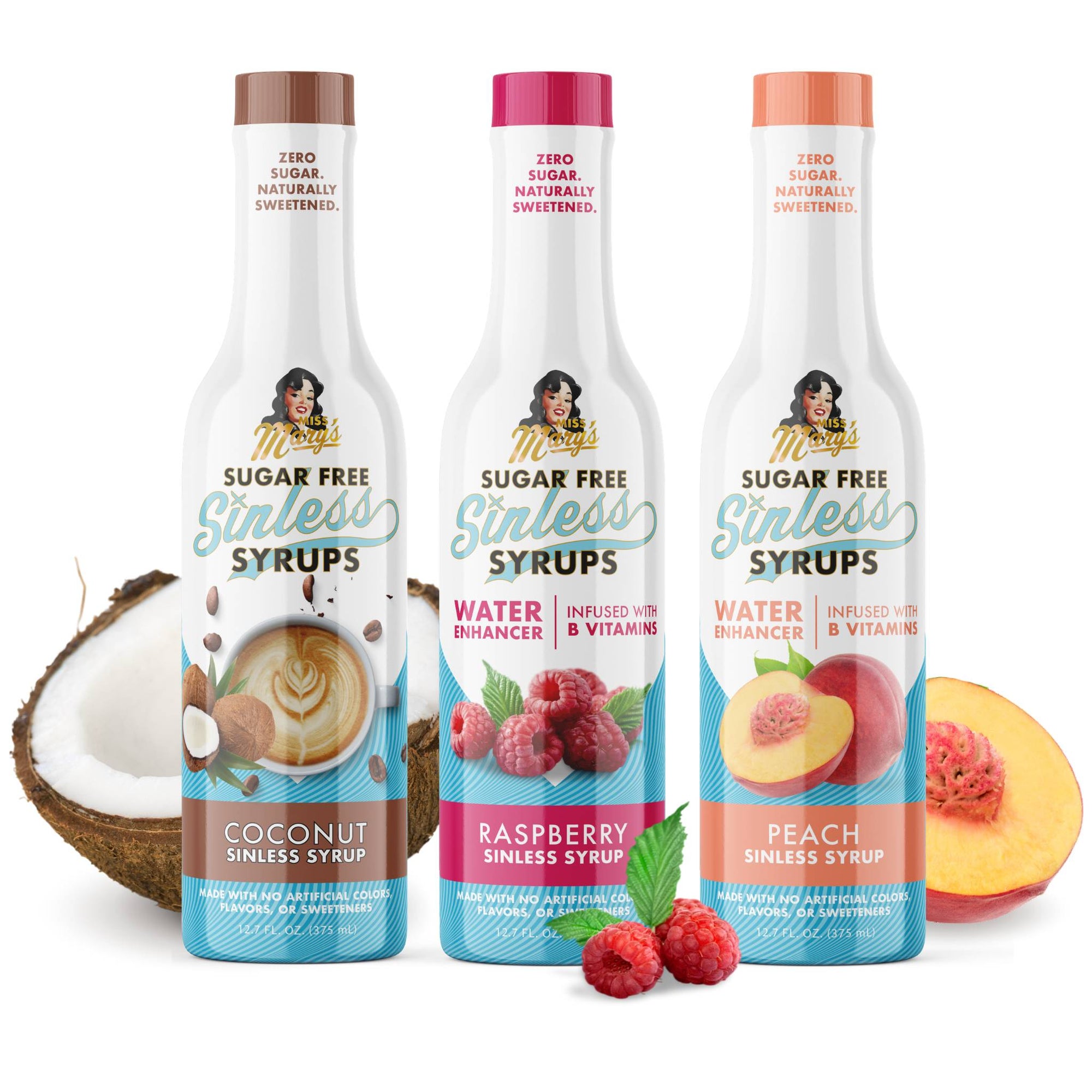 Three bottles of sugar-free syrups with coconut, raspberry, and peach flavors on a white background.