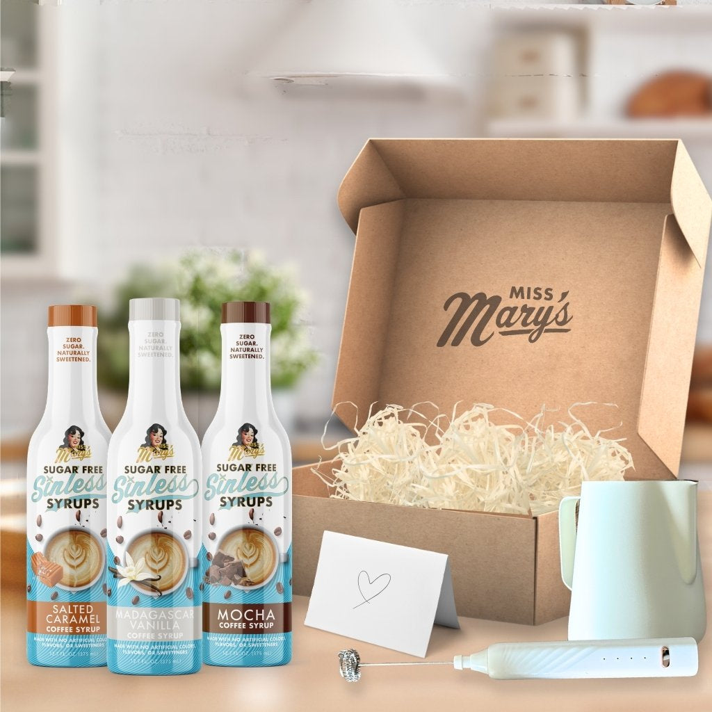 Three bottles of sugar-free syrups in front of a 'Miss Mary's' branded box.