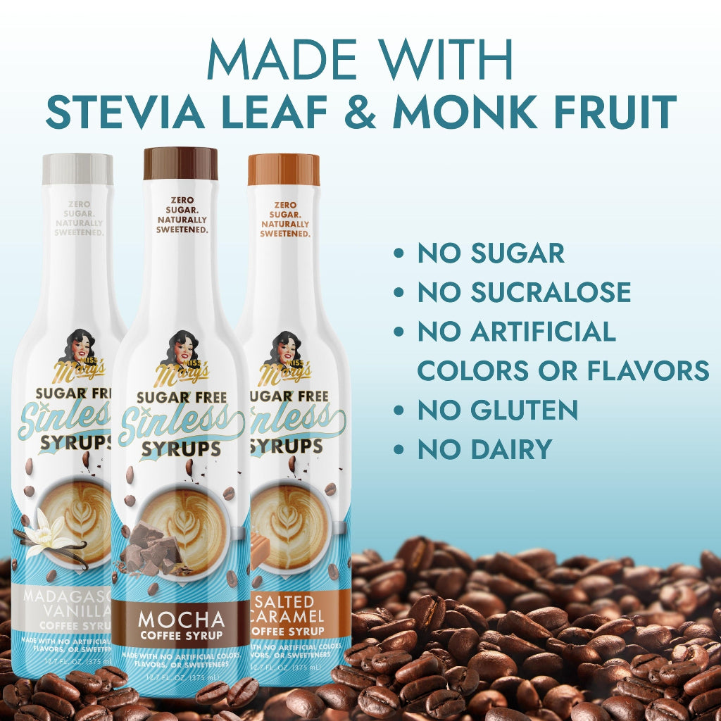 Madagascar Vanilla, Mocha, and Salted Caramel Sinless Syrup bottles with text "Made with Stevia Leaf &amp; Monk Fruit" on light blue gradient background with coffee beans at the bottom.