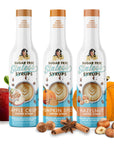 trio of fall flavor syrups on a white background with flavor images