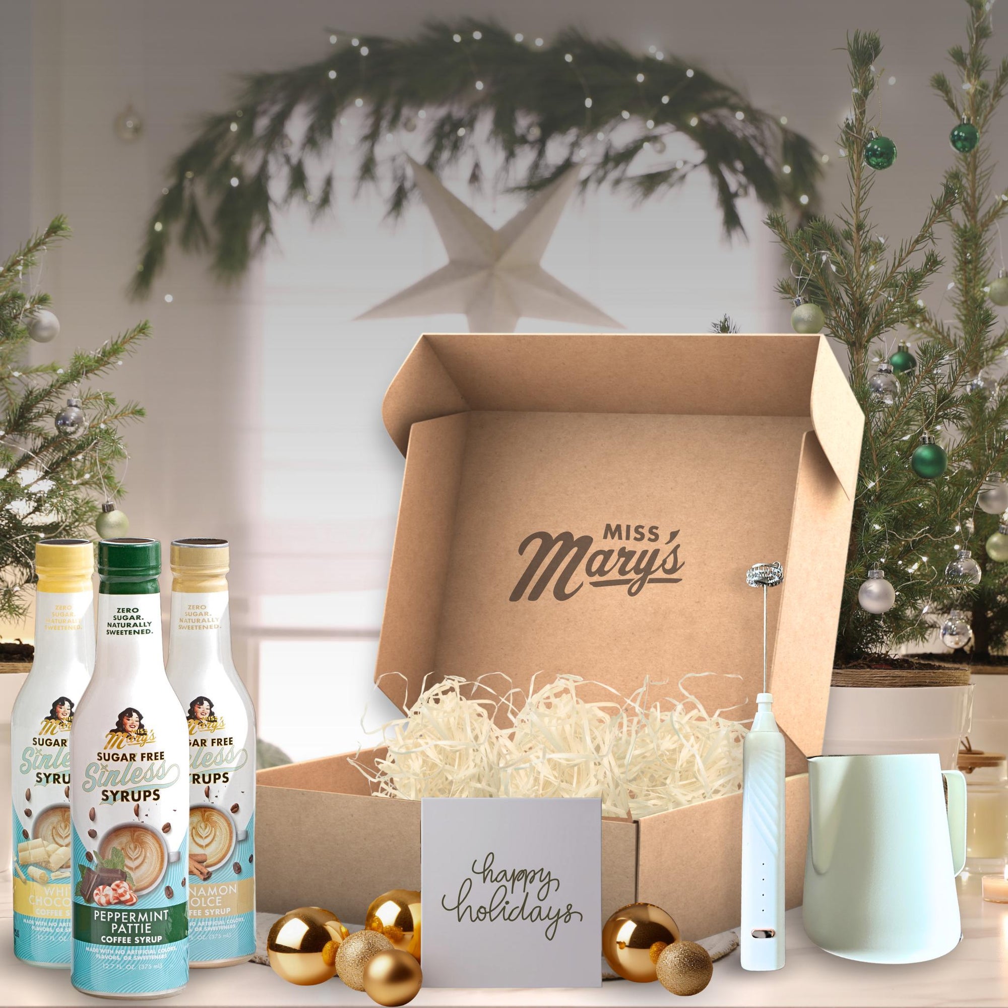 Syrup gift box with frothing accessories on holiday background