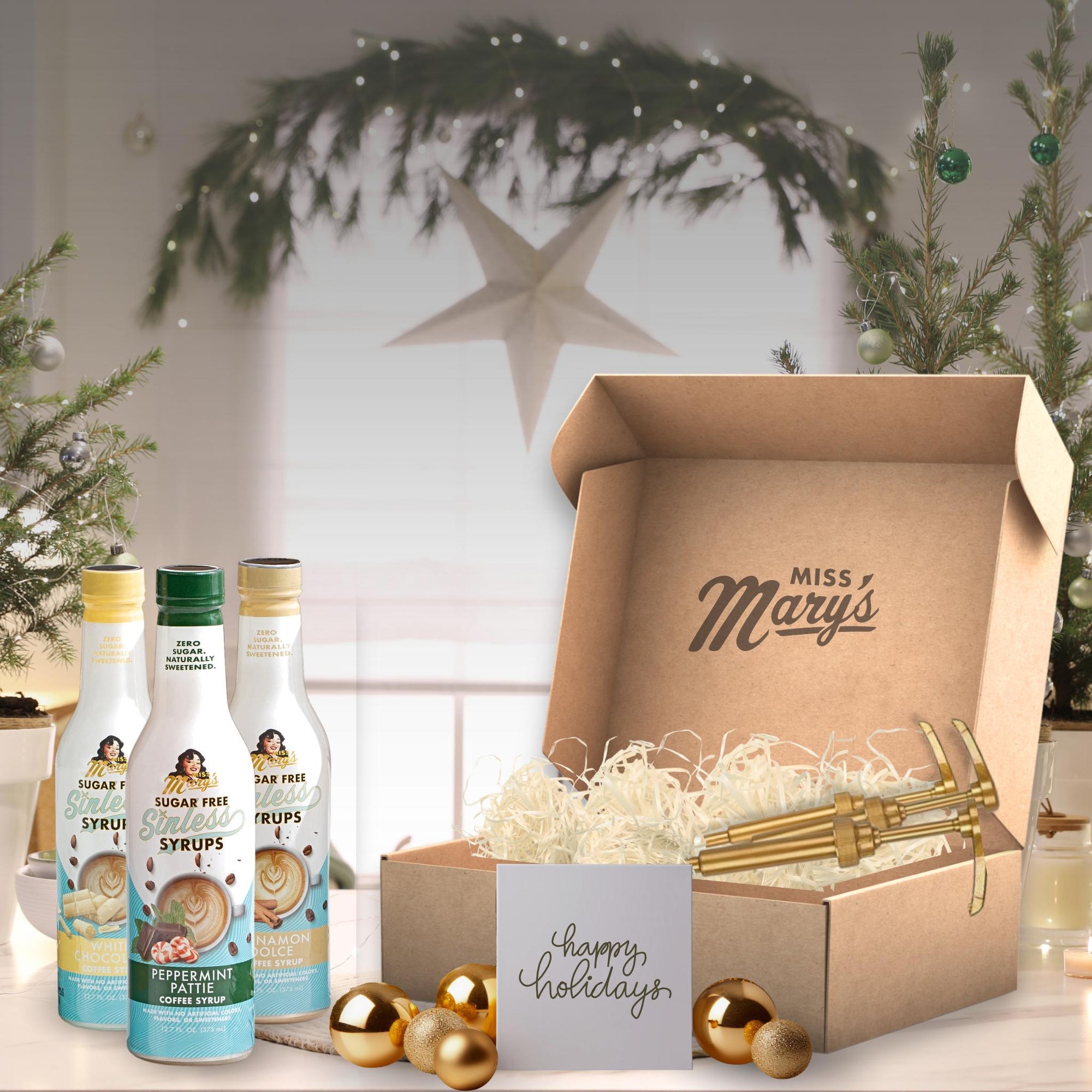 Gift set with 'Miss Mary's' syrups and decorative items on a festive background