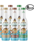 Six bottles of sugar free coffee syrup - almond biscotti, coconut, and irish cream on white background
