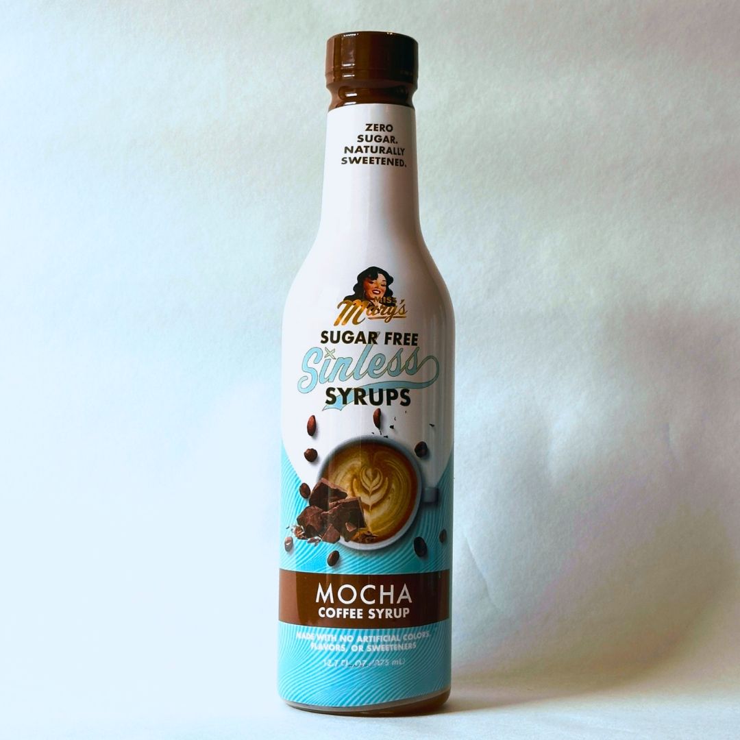 Miss Mary's Mocha Sugar Free Sinless Syrup bottle on blue background