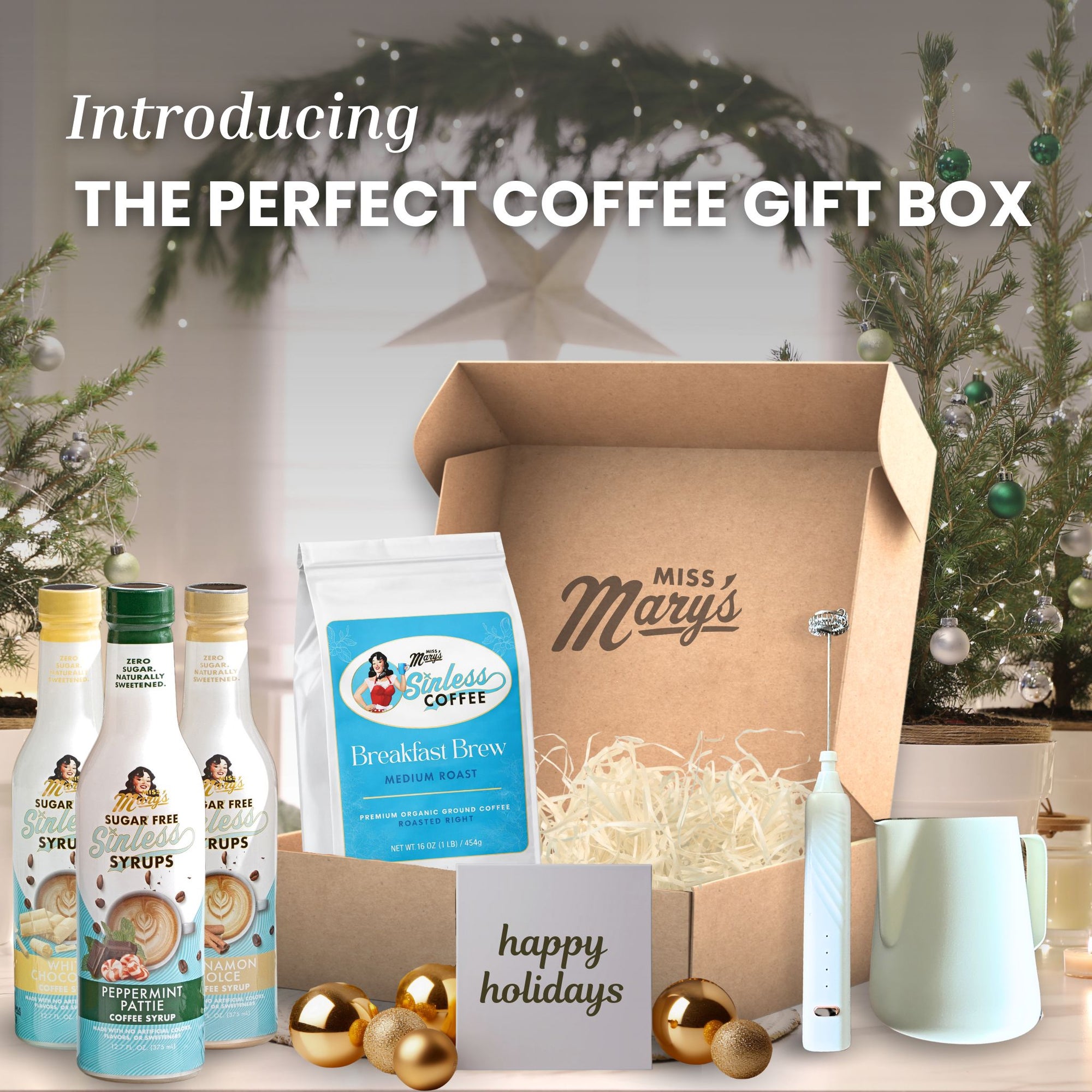 Coffee gift box with various coffee products and a card on a festive background.