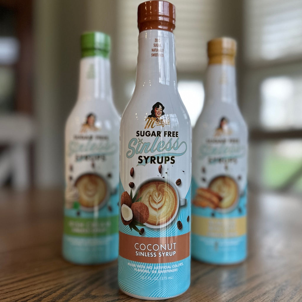 Coconut Sugar Free Sinless Syrup and other bottles on a wooden surface.