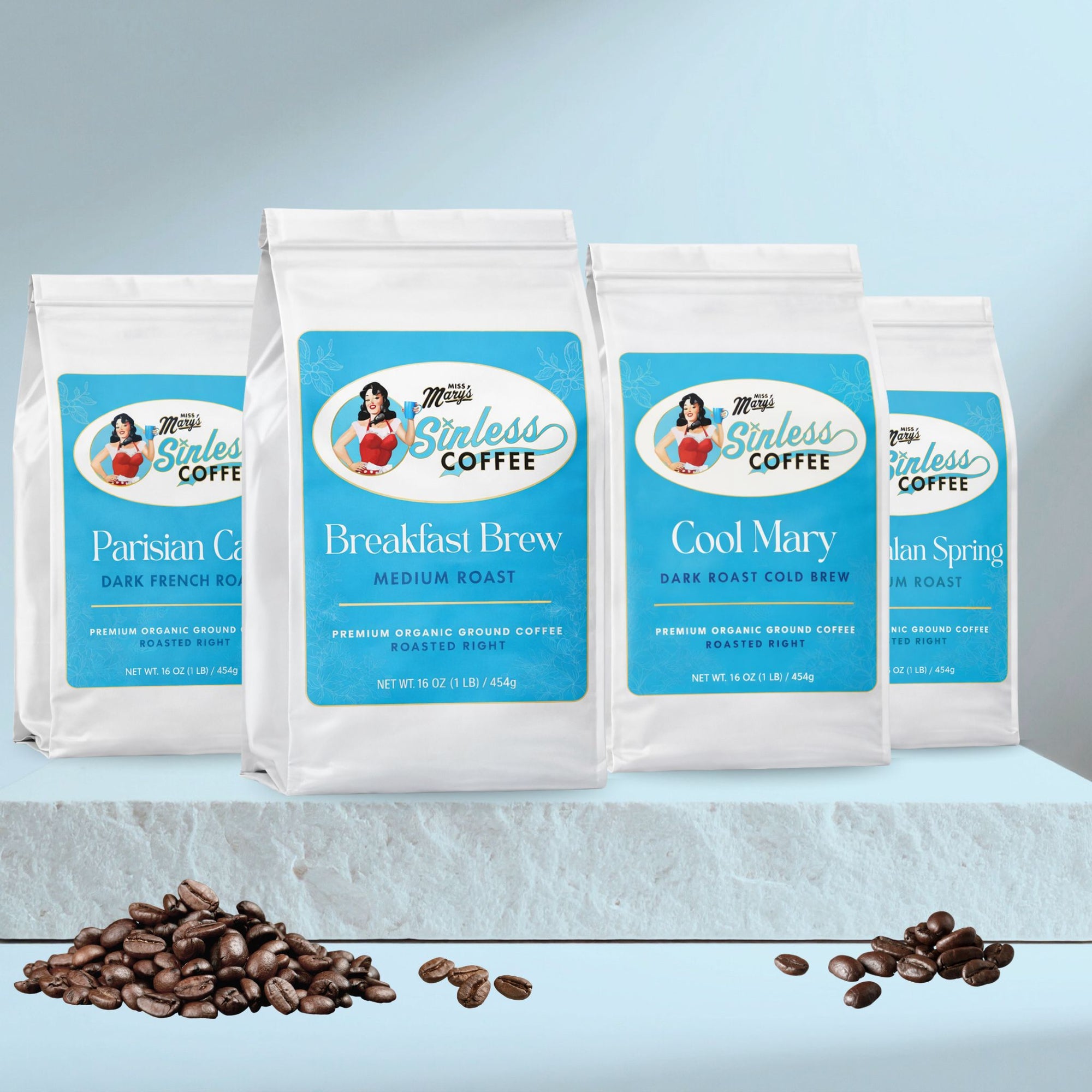 Four packages of Sinless Coffee with coffee beans on a light blue background