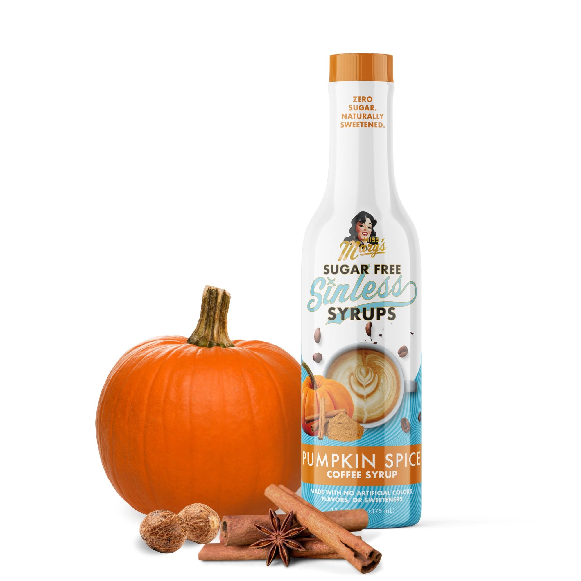 Bottle of pumpkin spice coffee syrup with a pumpkin, nuts, and cinnamon sticks on a white background