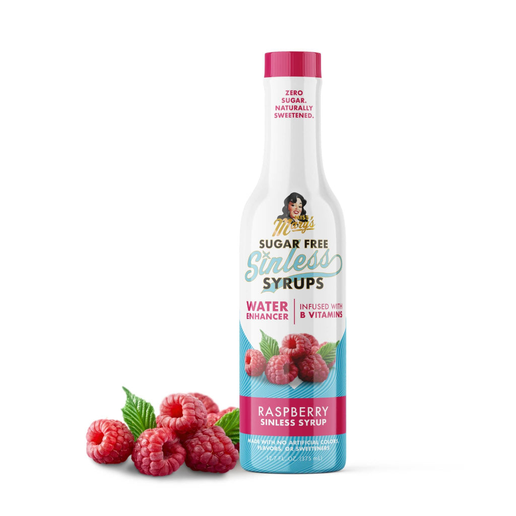 Bottle of sugar-free raspberry syrup with raspberries on a white background