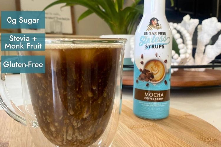 Miss Mary's Mocha Sugar Free Sinless Syrup and glass coffee mug with attributes "0g sugar, Stevia+Monk Fruit, Gluten-Free"