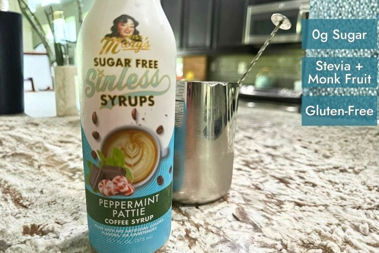 Peppermint Pattie Sugar Free Sinless Syrup and milk frother on granite counter with text "0g Sugar, Stevia + Monk Fruit, and  Gluten-Free"