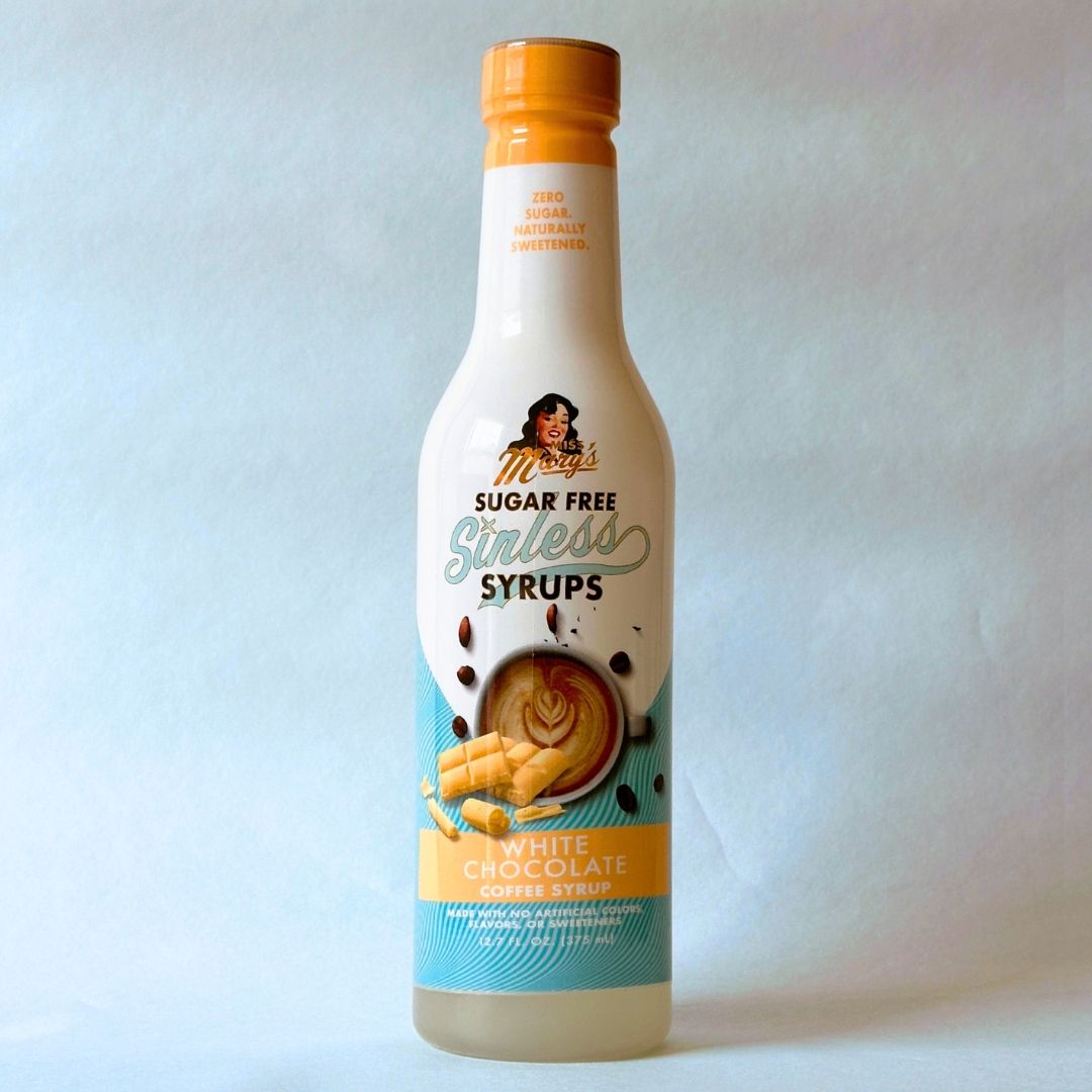 Miss Mary's White Chocolate Sugar Free Sinless Syrup bottle on blue background