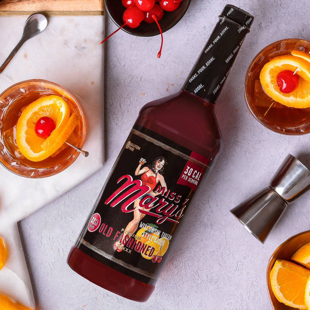 Wisconsin Old Fashioned Mix with oranges and cherries on grey table